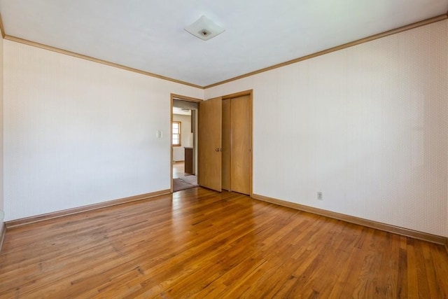 7210 Beechwood Dr, Urbandale, IA 50322 - unfurnished room featuring light wood-style floors and crown molding