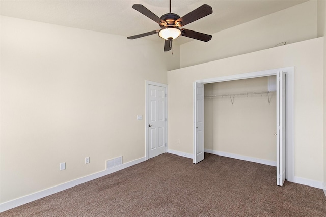 8302 Westown Pkwy Unit 1102, West Des Moines, IA 50266 - unfurnished bedroom featuring dark colored carpet, a closet, and ceiling fan