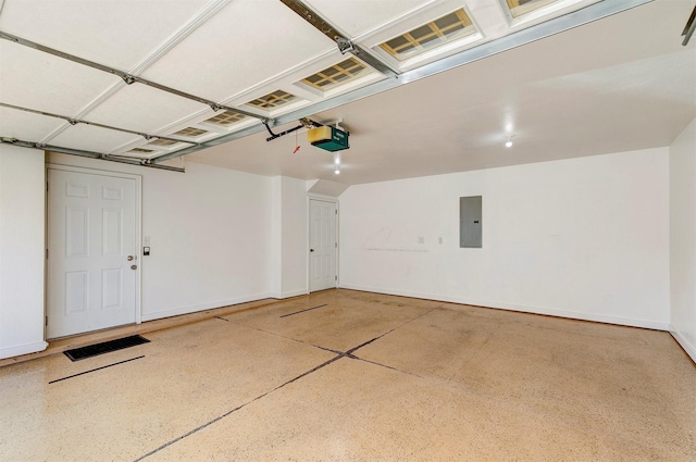 8302 Westown Pkwy Unit 1102, West Des Moines, IA 50266 - garage featuring electric panel and a garage door opener