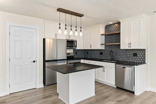 8302 Westown Pkwy Unit 1102, West Des Moines, IA 50266 - kitchen featuring appliances with stainless steel finishes, white cabinetry, backsplash, and light wood-style floors