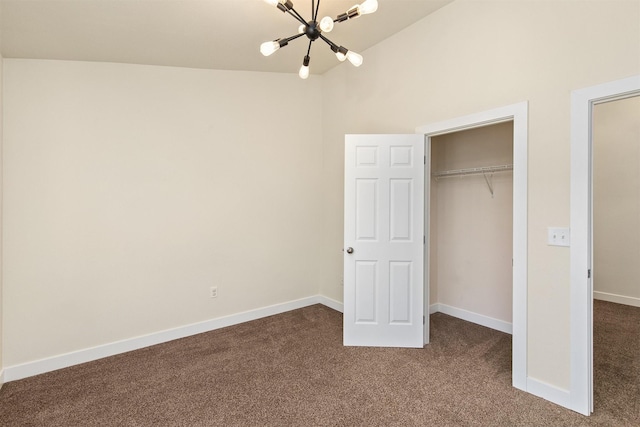 8302 Westown Pkwy Unit 1102, West Des Moines, IA 50266 - unfurnished bedroom featuring a chandelier, dark carpet, and a closet