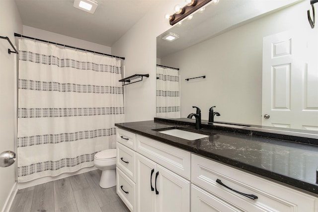 8302 Westown Pkwy Unit 1102, West Des Moines, IA 50266 - full bath featuring vanity, wood finished floors, and a shower with shower curtain