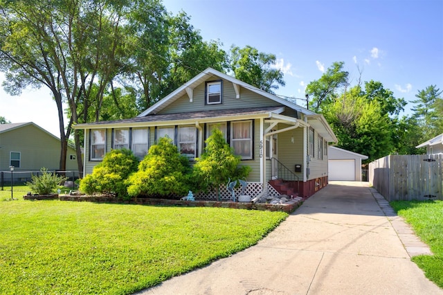 5910 Tonka Ave, Des Moines, IA 50312 - bungalow featuring an outdoor structure and a detached garage