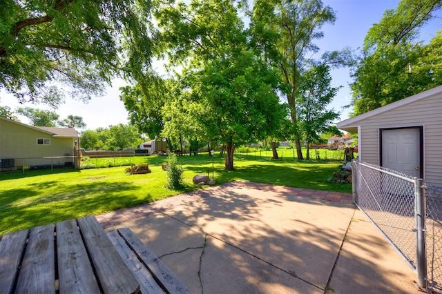 5910 Tonka Ave, Des Moines, IA 50312 - fenced backyard featuring a patio area