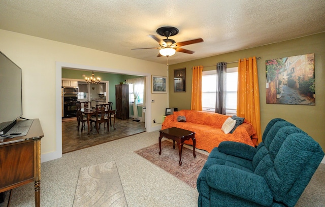5910 Tonka Ave, Des Moines, IA 50312 - living room featuring a chandelier, carpet flooring, ceiling fan, and a textured ceiling