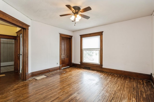 1805 S D Ave, Lovilia, IA 50150 - empty room featuring wood finished floors and ceiling fan