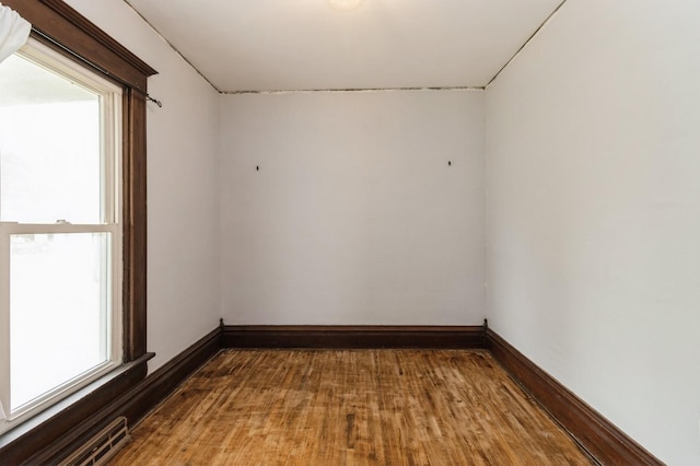 1805 S D Ave, Lovilia, IA 50150 - spare room with wood finished floors and baseboards