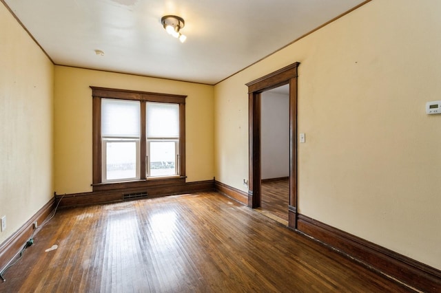 1805 S D Ave, Lovilia, IA 50150 - empty room featuring wood finished floors and baseboards