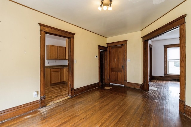 1805 S D Ave, Lovilia, IA 50150 - spare room with dark wood-style floors and baseboards