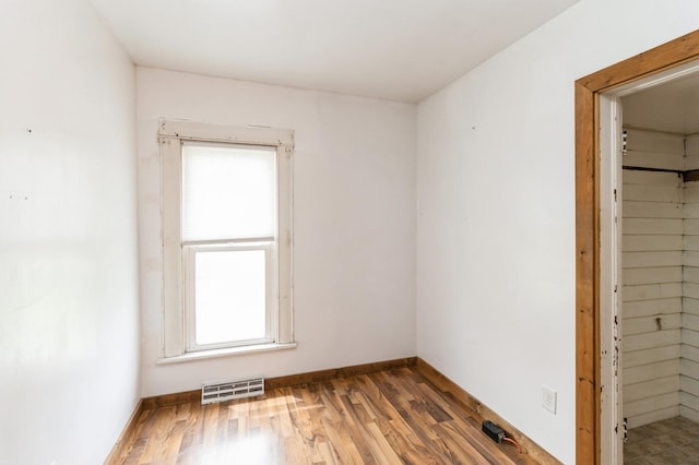 1805 S D Ave, Lovilia, IA 50150 - unfurnished bedroom with wood finished floors and a closet