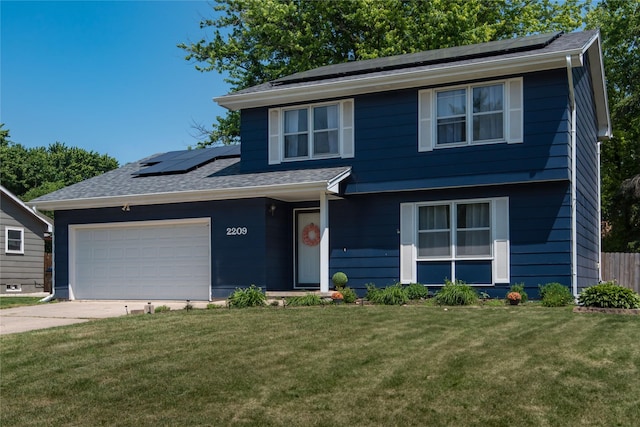 2209 4th St SW, Altoona, IA 50009 - view of front of home with roof mounted solar panels, an attached garage, concrete driveway, and a shingled roof