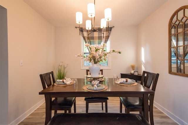 2209 4th St SW, Altoona, IA 50009 - dining space with a chandelier, wood finished floors, and healthy amount of natural light