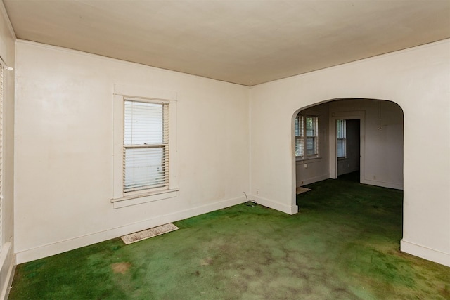 802 Fulton Dr, Des Moines, IA 50315 - carpeted empty room with arched walkways and baseboards