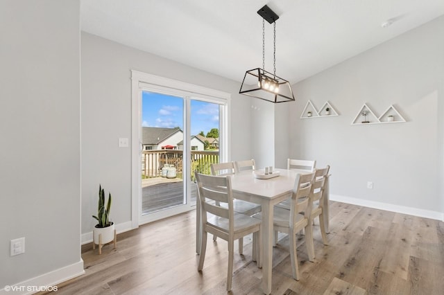 2670 Long Ave, Van Meter, IA 50261 - dining room featuring light wood finished floors and a chandelier