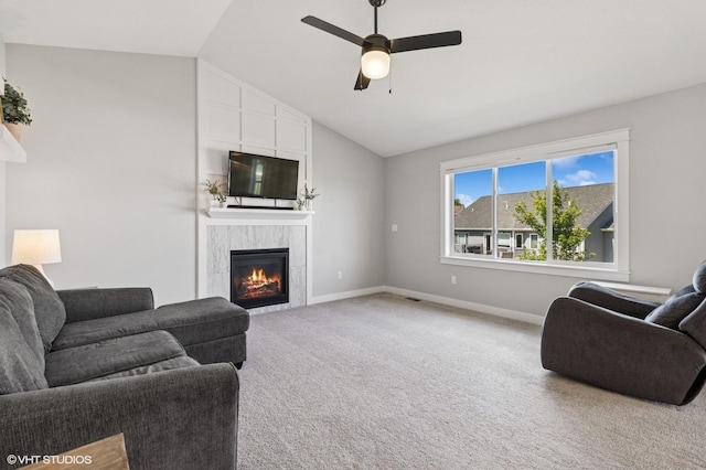 2670 Long Ave, Van Meter, IA 50261 - living room with a fireplace, lofted ceiling, light colored carpet, and a ceiling fan