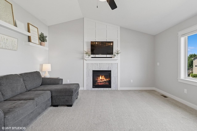 2670 Long Ave, Van Meter, IA 50261 - carpeted living area with ceiling fan, vaulted ceiling, and a premium fireplace