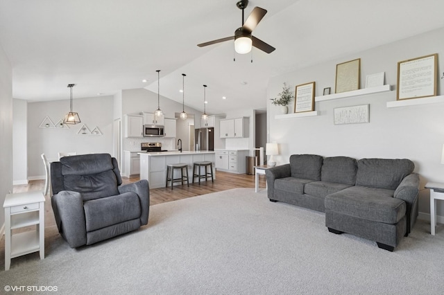 2670 Long Ave, Van Meter, IA 50261 - living room featuring lofted ceiling, ceiling fan, and light carpet