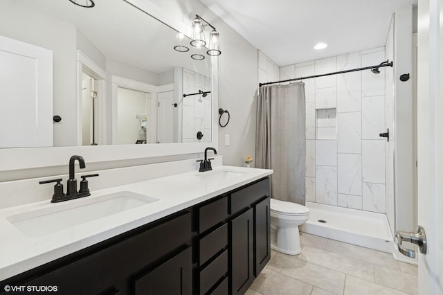 2670 Long Ave, Van Meter, IA 50261 - bathroom featuring a tile shower, double vanity, and tile patterned floors
