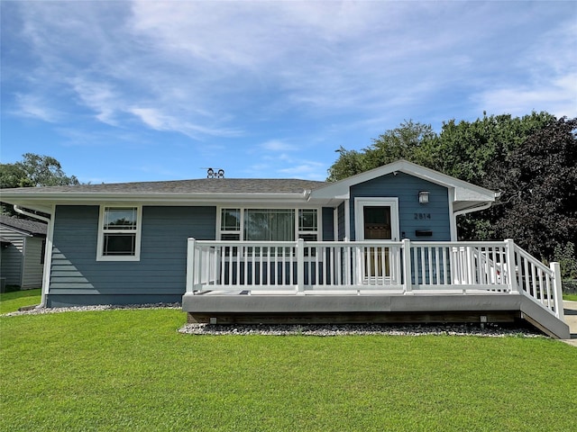 2814 Chicago Ave, Des Moines, IA 50317 - rear view of house with a yard and a deck