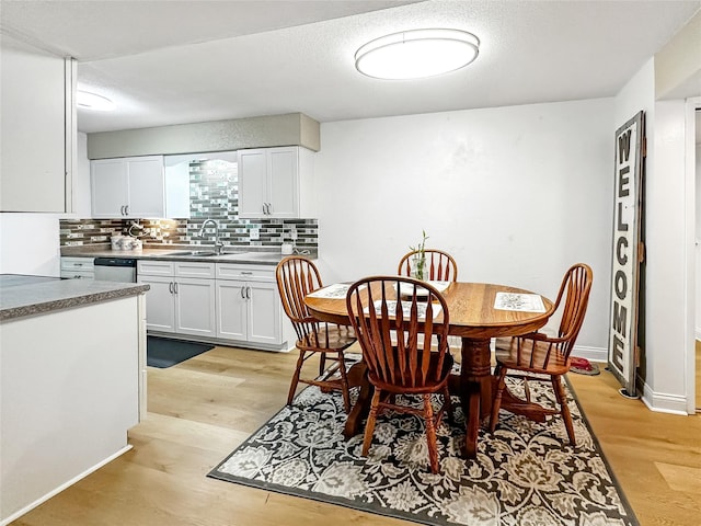 9513 University Ave Unit 12, Clive, IA 50325 - dining room with light wood-style floors