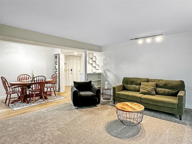 9513 University Ave Unit 12, Clive, IA 50325 - living area featuring track lighting and wood finished floors