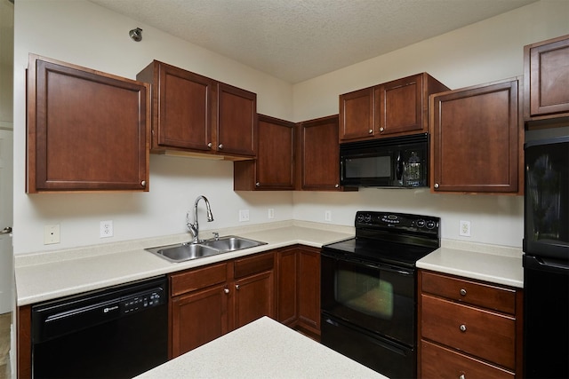 8601 Westown Pkwy Unit 5114, West Des Moines, IA 50266 - kitchen featuring black appliances, light countertops, and a textured ceiling