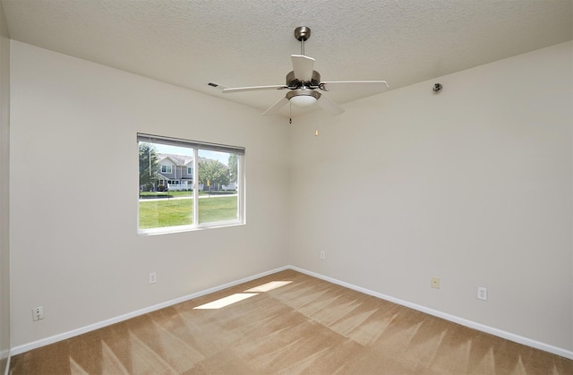 8601 Westown Pkwy Unit 5114, West Des Moines, IA 50266 - unfurnished room featuring light carpet, a ceiling fan, and a textured ceiling