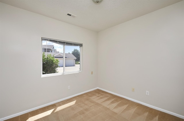 8601 Westown Pkwy Unit 5114, West Des Moines, IA 50266 - spare room featuring baseboards and light colored carpet