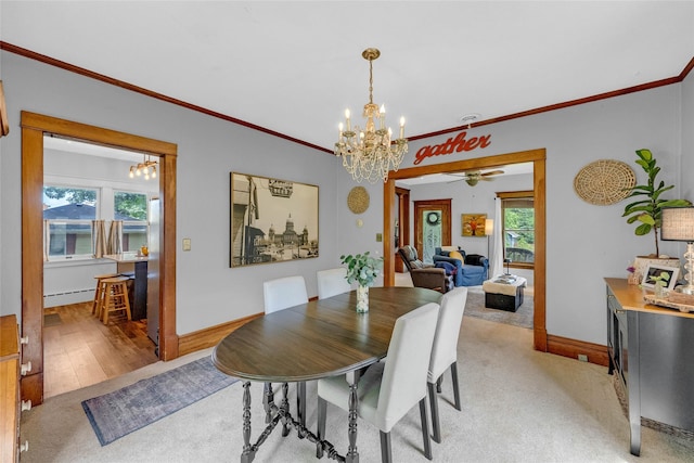 3602 64th St, Urbandale, IA 50322 - dining area with a chandelier, crown molding, light colored carpet, a baseboard heating unit, and a ceiling fan