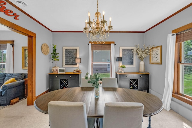 3602 64th St, Urbandale, IA 50322 - dining room featuring carpet, a chandelier, plenty of natural light, and crown molding