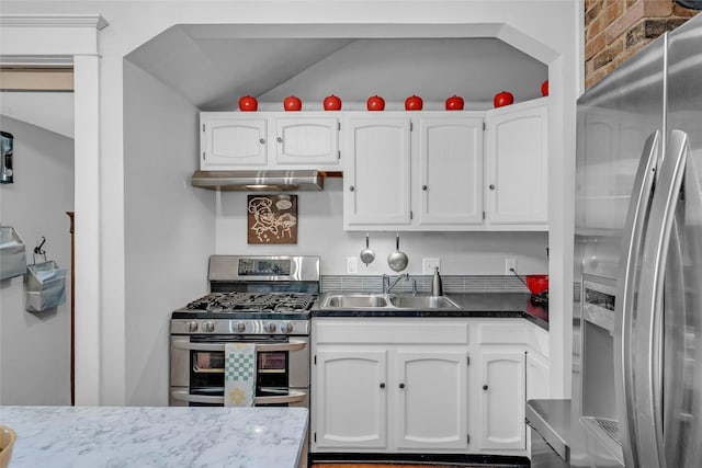 3602 64th St, Urbandale, IA 50322 - kitchen featuring stainless steel appliances, white cabinets, and ventilation hood