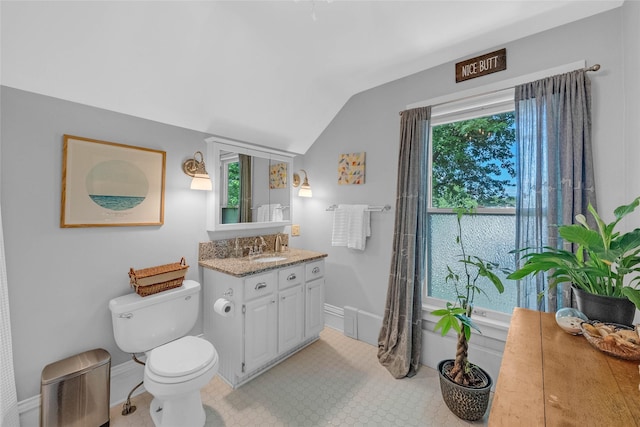 3602 64th St, Urbandale, IA 50322 - bathroom featuring lofted ceiling and vanity