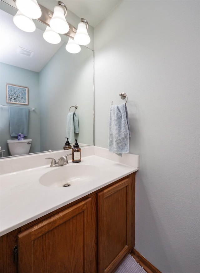 5030 Oakcreek Dr, Norwalk, IA 50211 - bathroom with vanity and toilet