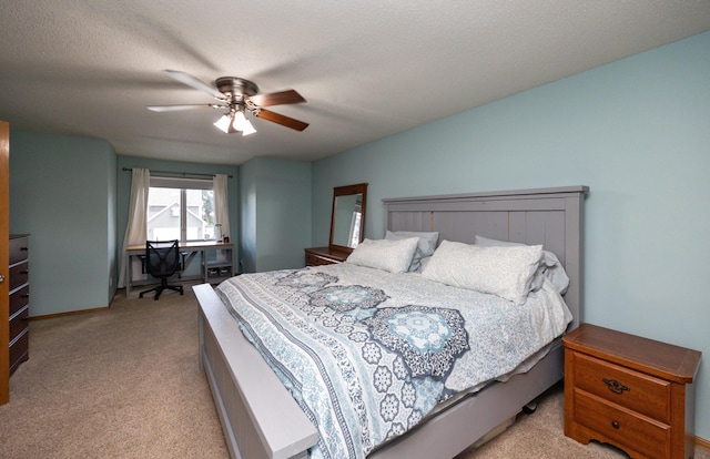 5030 Oakcreek Dr, Norwalk, IA 50211 - bedroom with light colored carpet, ceiling fan, and a desk