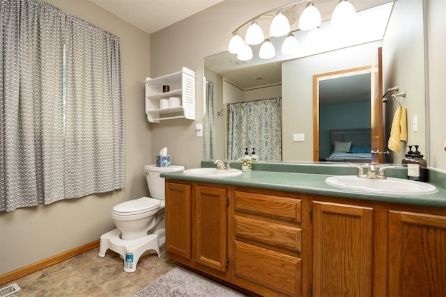5030 Oakcreek Dr, Norwalk, IA 50211 - bathroom featuring double vanity and toilet