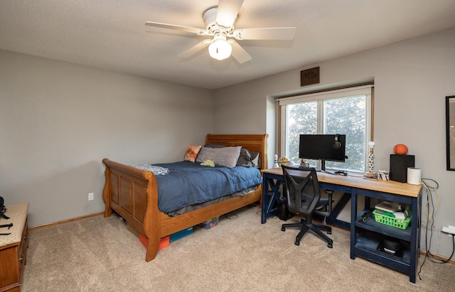 5030 Oakcreek Dr, Norwalk, IA 50211 - bedroom featuring light colored carpet, an office area, and ceiling fan