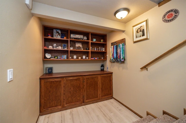 5030 Oakcreek Dr, Norwalk, IA 50211 - stairs with wood finished floors and baseboards