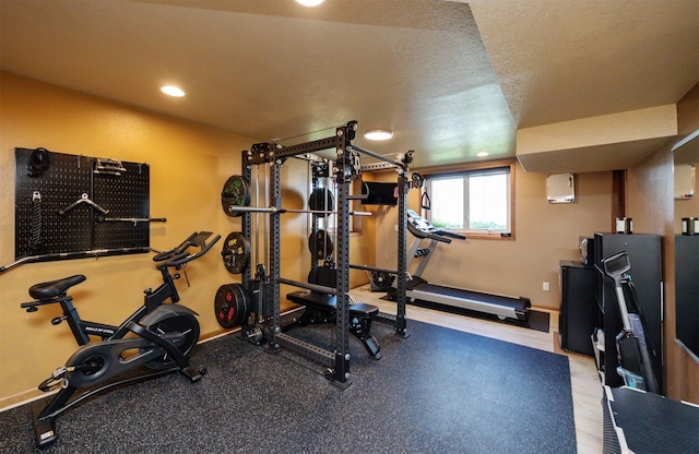 5030 Oakcreek Dr, Norwalk, IA 50211 - exercise room featuring baseboards and recessed lighting