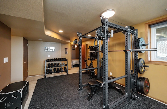 5030 Oakcreek Dr, Norwalk, IA 50211 - exercise room with a textured ceiling and recessed lighting