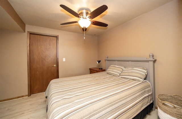 5030 Oakcreek Dr, Norwalk, IA 50211 - bedroom with light wood-style flooring and a ceiling fan