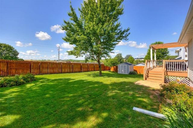 5030 Oakcreek Dr, Norwalk, IA 50211 - fenced backyard featuring a storage unit and a wooden deck