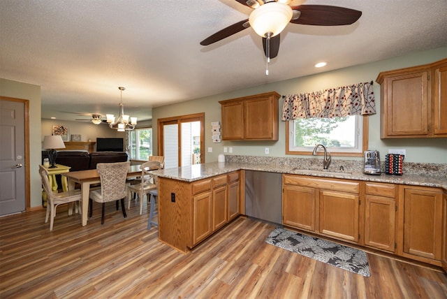 5030 Oakcreek Dr, Norwalk, IA 50211 - kitchen featuring dishwasher, a peninsula, light wood-type flooring, ceiling fan, and recessed lighting