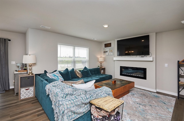 4727 170th Pl, Urbandale, IA 50323 - living area with wood finished floors and a glass covered fireplace