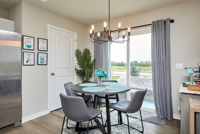 4727 170th Pl, Urbandale, IA 50323 - dining space with a chandelier and wood finished floors