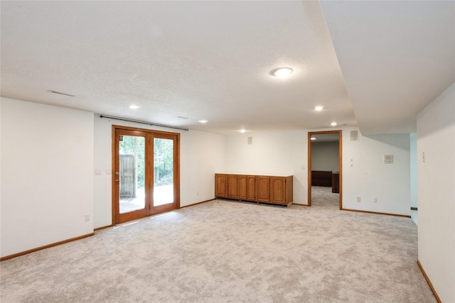 1711 Plaza Cir, Windsor Heights, IA 50324 - spare room with recessed lighting, light carpet, and a textured ceiling