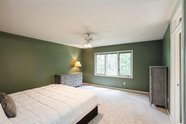 1711 Plaza Cir, Windsor Heights, IA 50324 - bedroom featuring light colored carpet and a ceiling fan