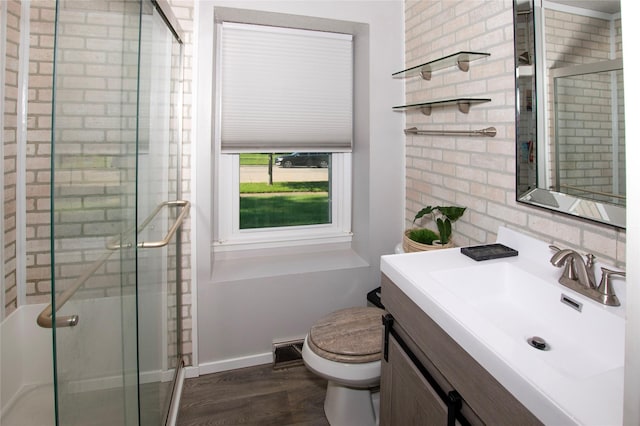 500 Scandia Ave, Des Moines, IA 50315 - bathroom with vanity, a stall shower, and wood finished floors