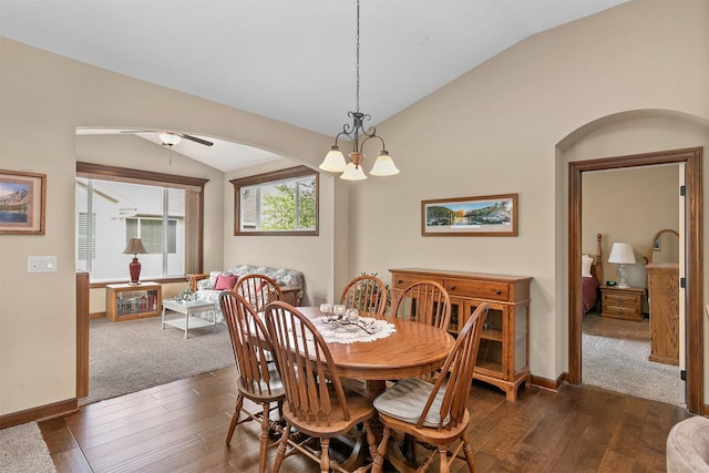 6054 Bradford Ln, Johnston, IA 50131 - dining area with lofted ceiling, dark wood-type flooring, a chandelier, arched walkways, and ceiling fan