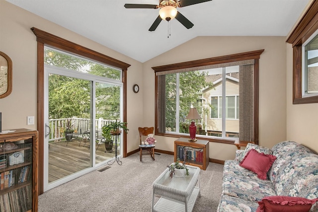 6054 Bradford Ln, Johnston, IA 50131 - living area with lofted ceiling, carpet, and a ceiling fan