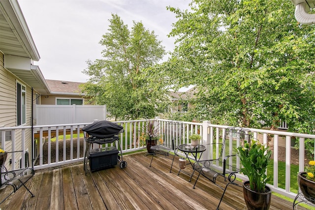 6054 Bradford Ln, Johnston, IA 50131 - wooden deck featuring a grill